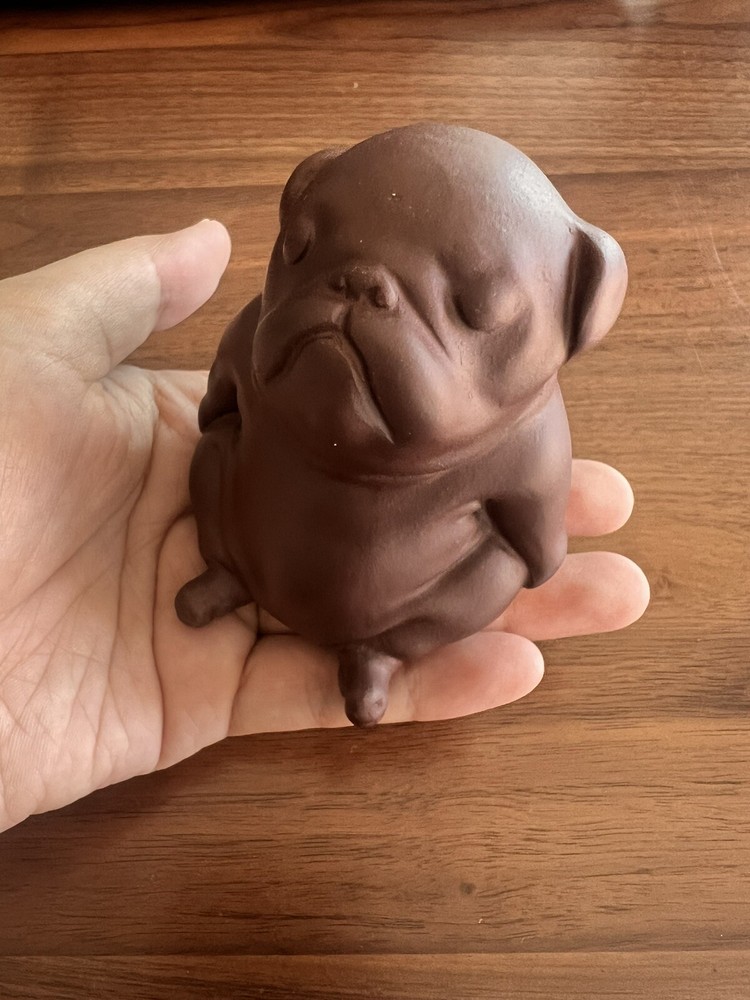 Purple clay ceramic puppy.