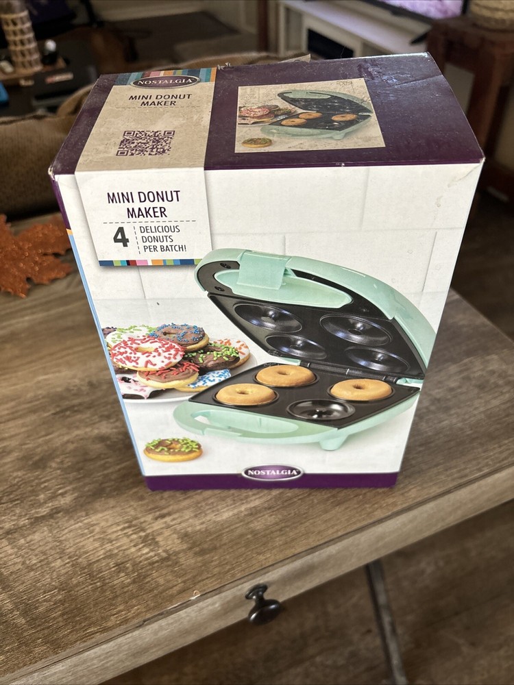 Nostalgia mini donut maker.  Makes 4 donuts per batch.  (Mint Green)