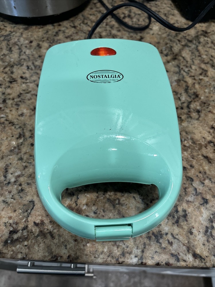 Nostalgia mini donut maker. Makes 4 donuts per batch. (Mint Green)