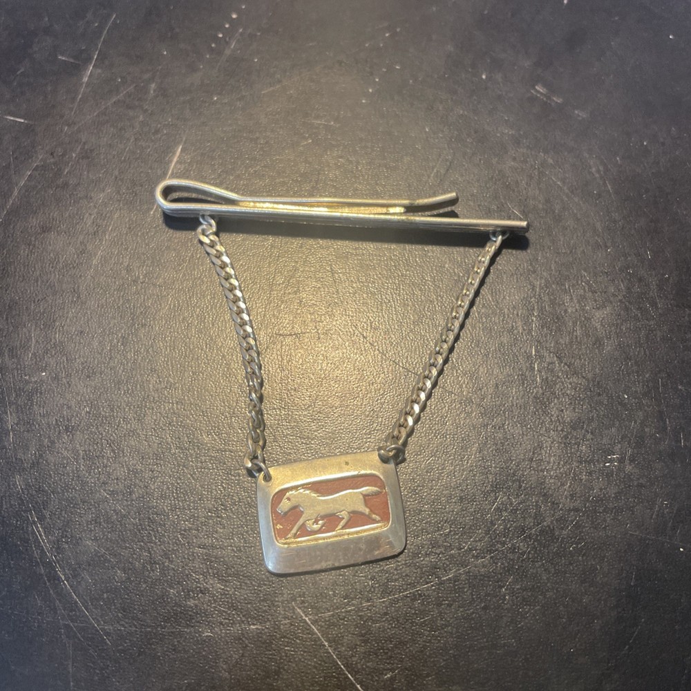 Silvertone clip with horse charm