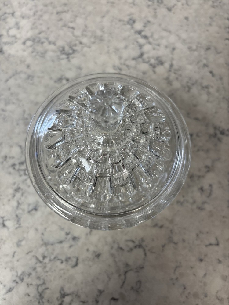 Clear pressed glass covered compote in the 'Cut Log' pattern.