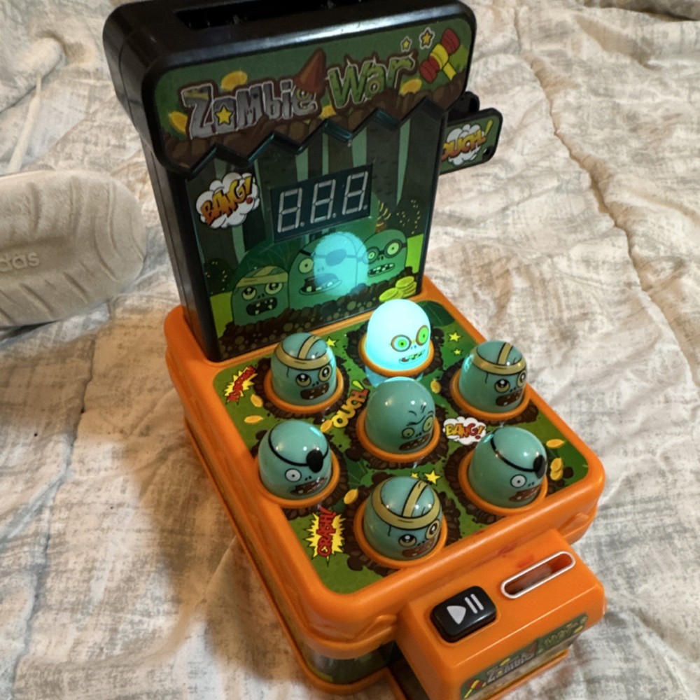 Zombie War Electronic Handheld Whack-a-Mole Game with Digital Score Display