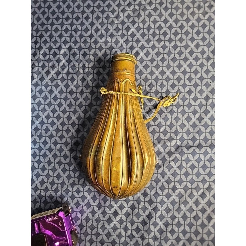 1800's original powder flask large dent on front. tip may be missing.