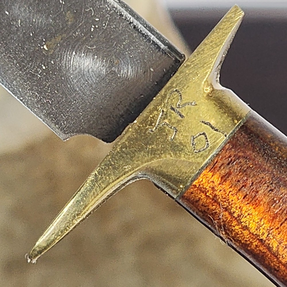 Small Knife In Bone looking Holder With Wolf On