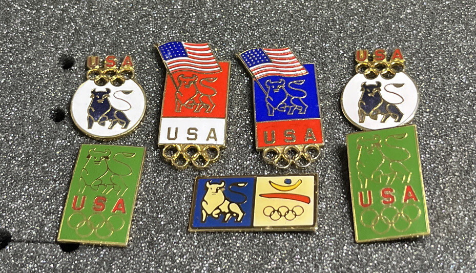 SEVEN (7) ASSORTED OLYMPICS PINS MERRILL LYNCH BULL