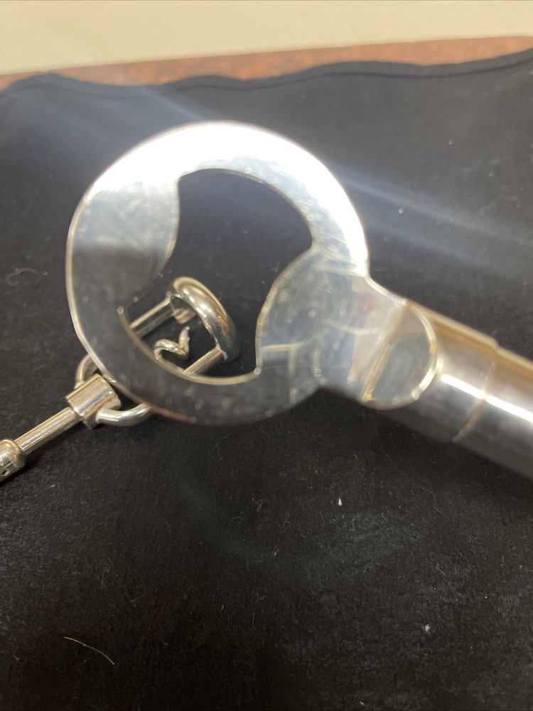 Silver corkscrew and bottle opener with blown glass insert