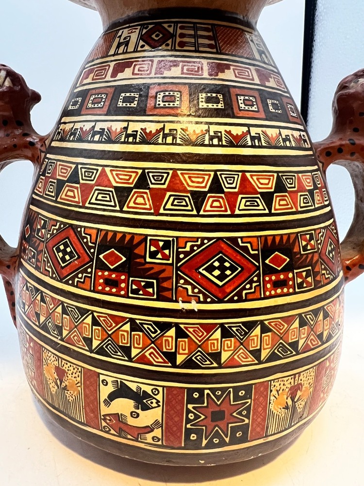 Peruvian ceramic stirrup vase with Jaguar handles and geometric designs