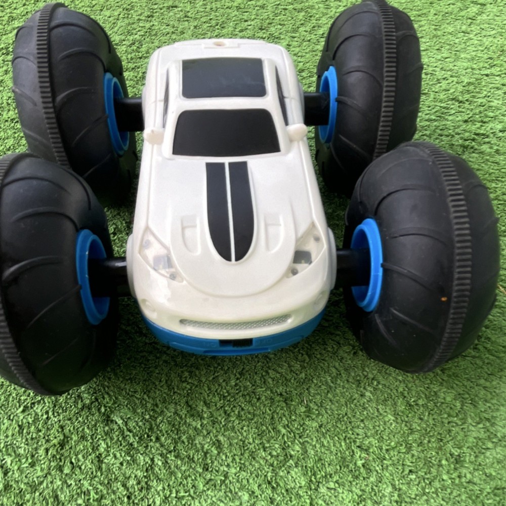 Remote-Controlled Stunt Car Blue White Black Oversized Wheels LED Lights