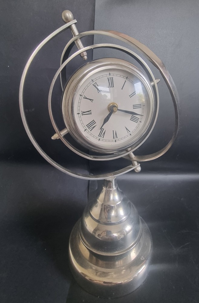 Orbital Clock (Battery) . Silver in Colour.