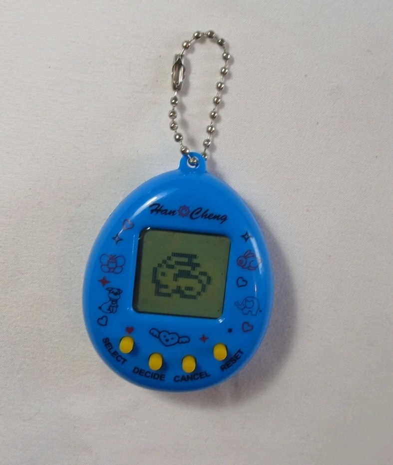 Han Cheng Virtual Pet Electronic Digital Handheld Game Generic Blue Egg Bunny