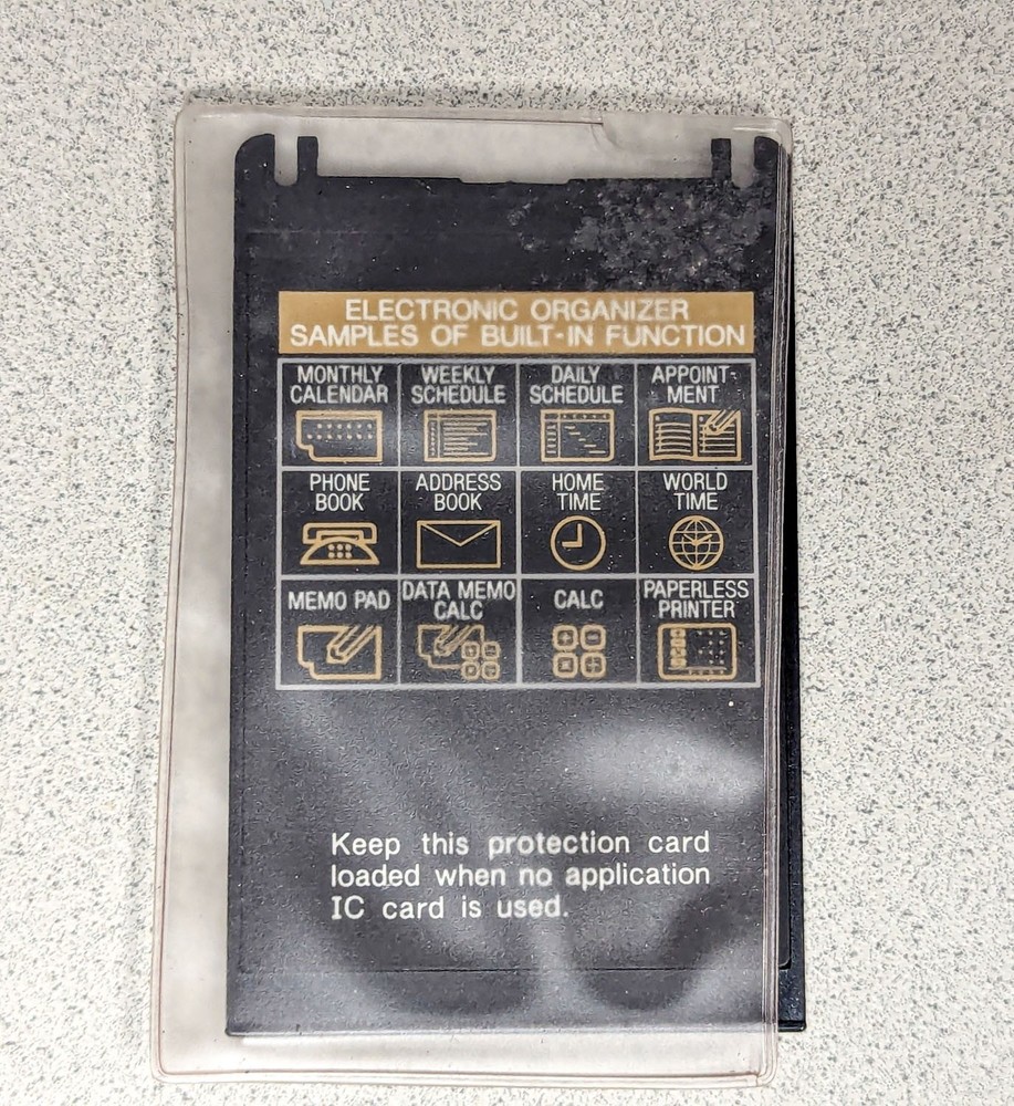 Sharp Wizard OZ-7000 Electronic Organizer with Time & Expense Manager Card