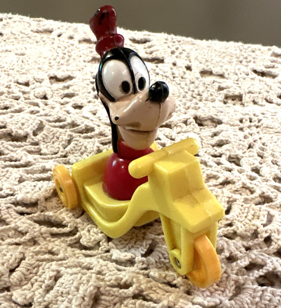 Vintage Goofy Plastic Disney Yellow Tricycle Roll Toy