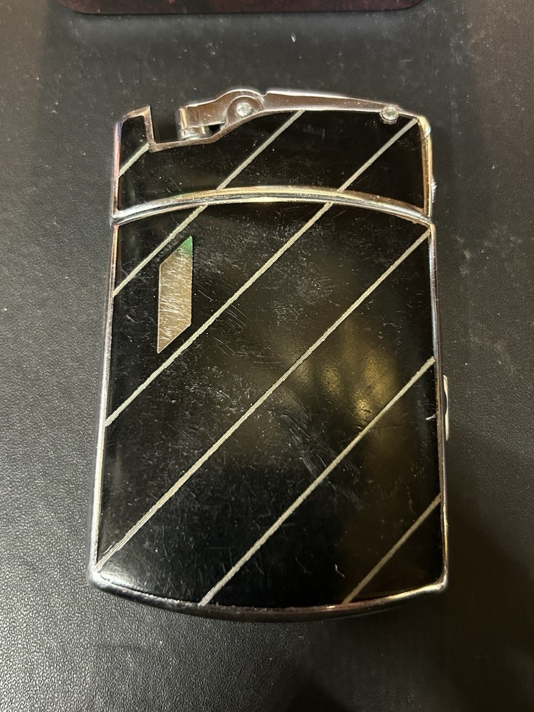 Vintage Ronson Tuxedo combination cigarette case and lighter.