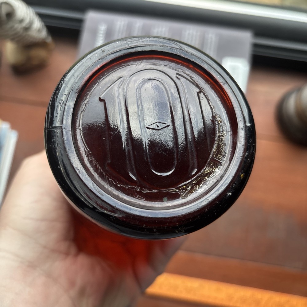 Stains Run From 101 Amber Embossed Bottle