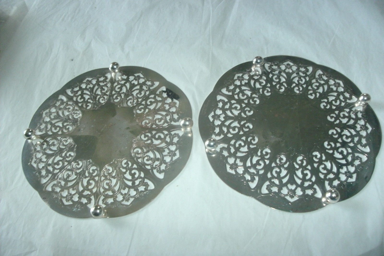 2 VINTAGE FOOTED SILVERPLATE TRIVETS, MADE IN WESTERN GERMANY, 6"