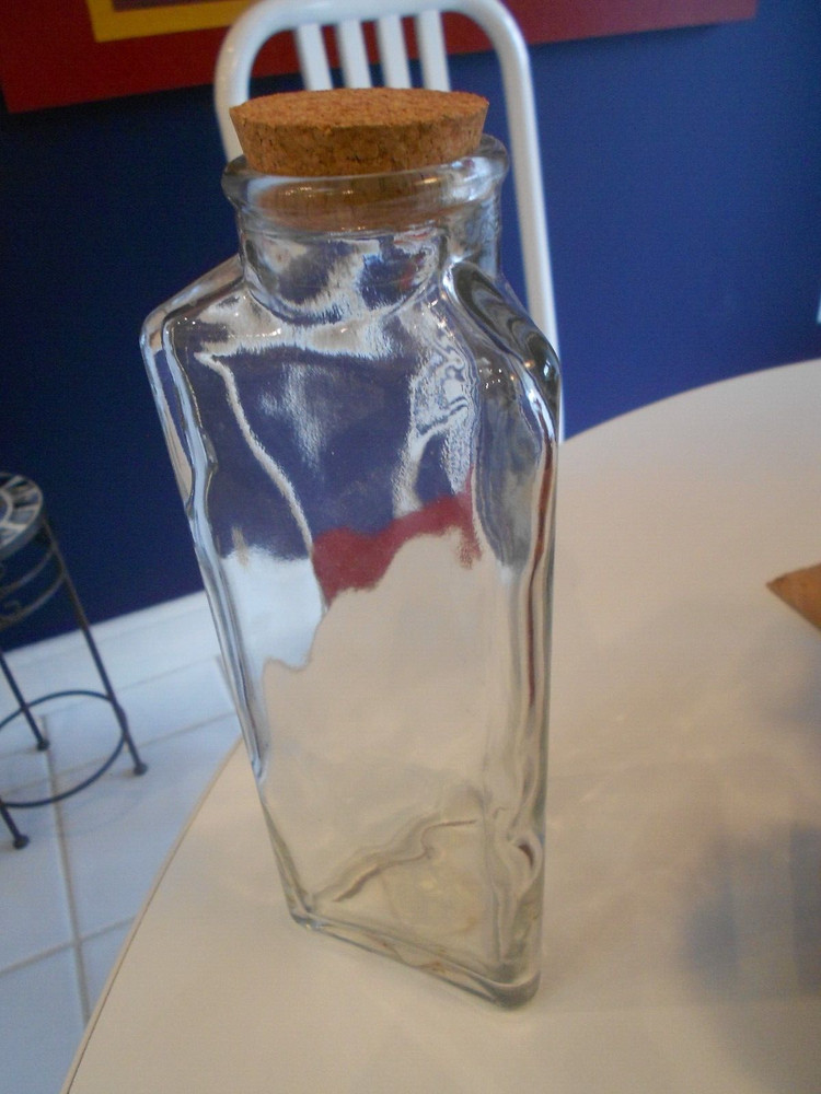 bottle with cork topper three flat sided 1999 issue 9 3/4" tall
