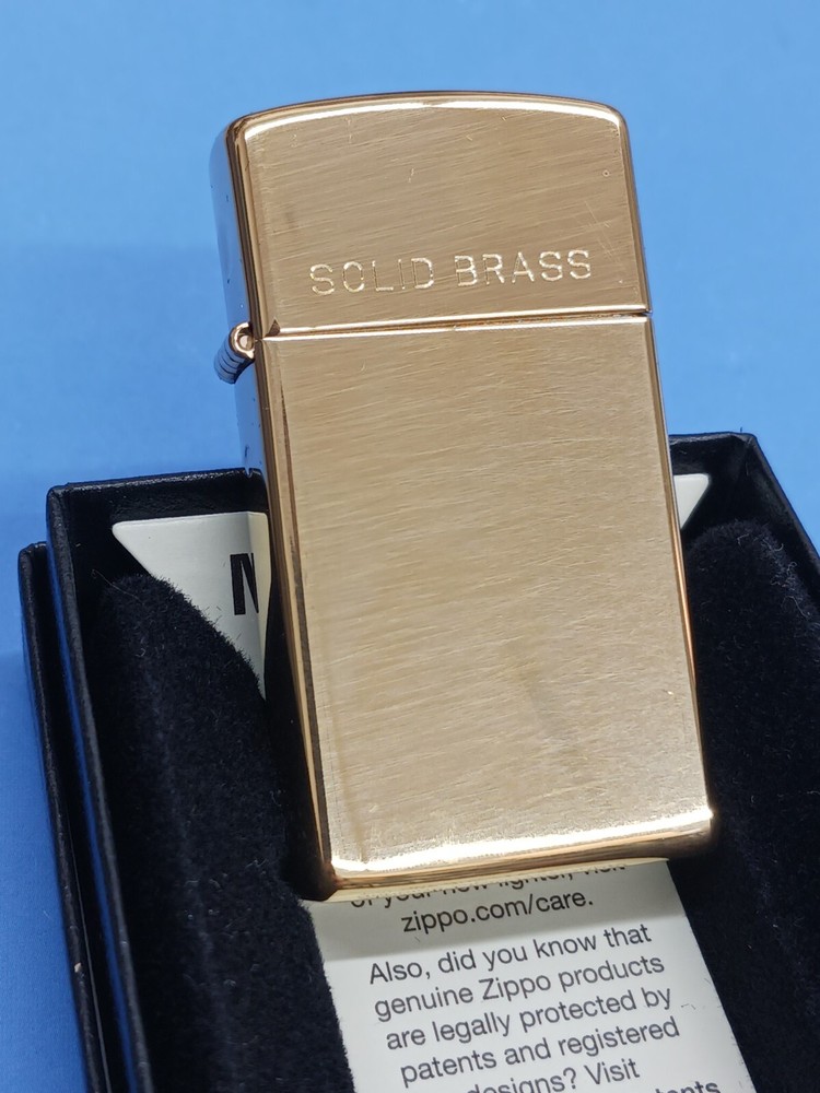 Zippo Slim High Polish Brass with Solid Brass Engraved 1654