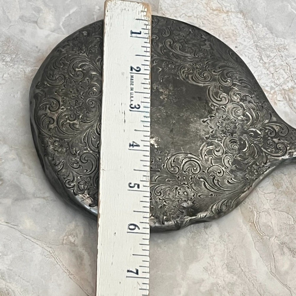 Silver Plated Hand Held Mirror with Intricate Raised Floral Scrollwork