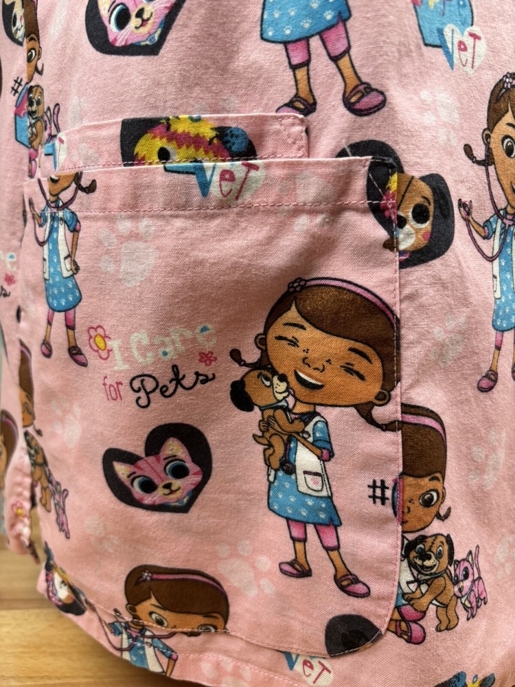 Women’s Disney Doc McStuffins Pink Scrub Top Size Medium