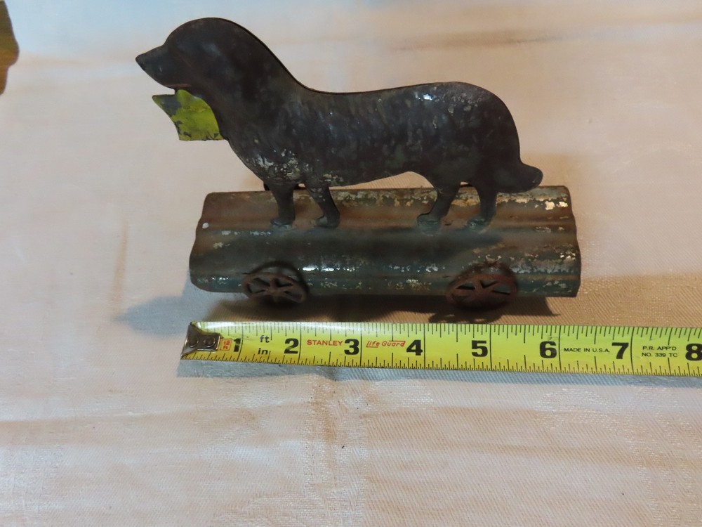 Antique tin dog pull toy