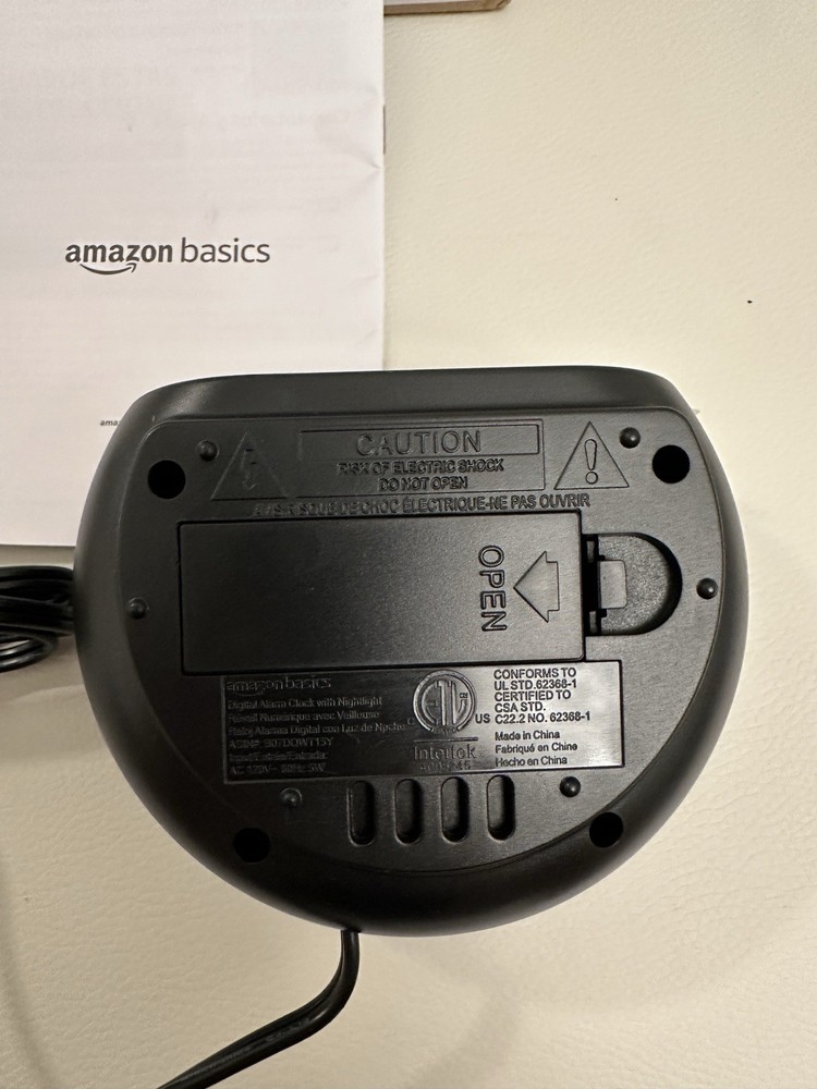 Amazon Basics Small Digital Oval Alarm Clock with LED Display, Nightlight & Batt