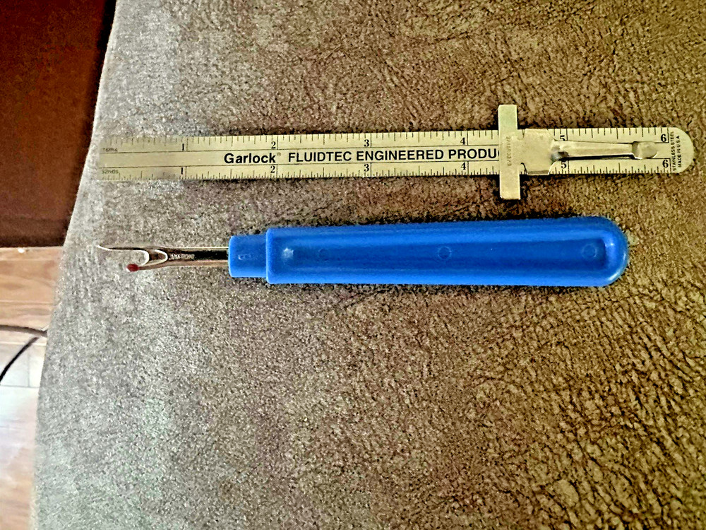 Garlock Slide Ruler and a Seam Ripper