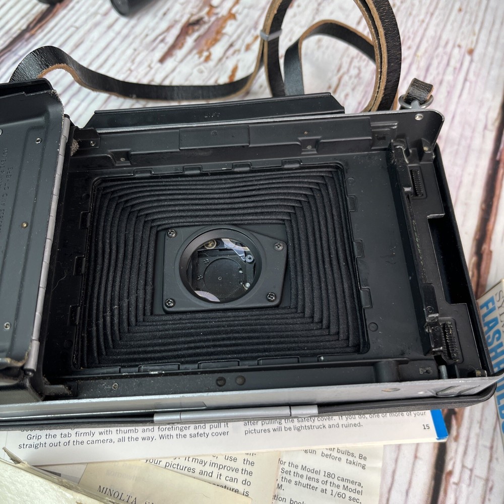 Vintage Polaroid Automatic 100 Land Camera with Case, Timer, Flash, Bulbs, More