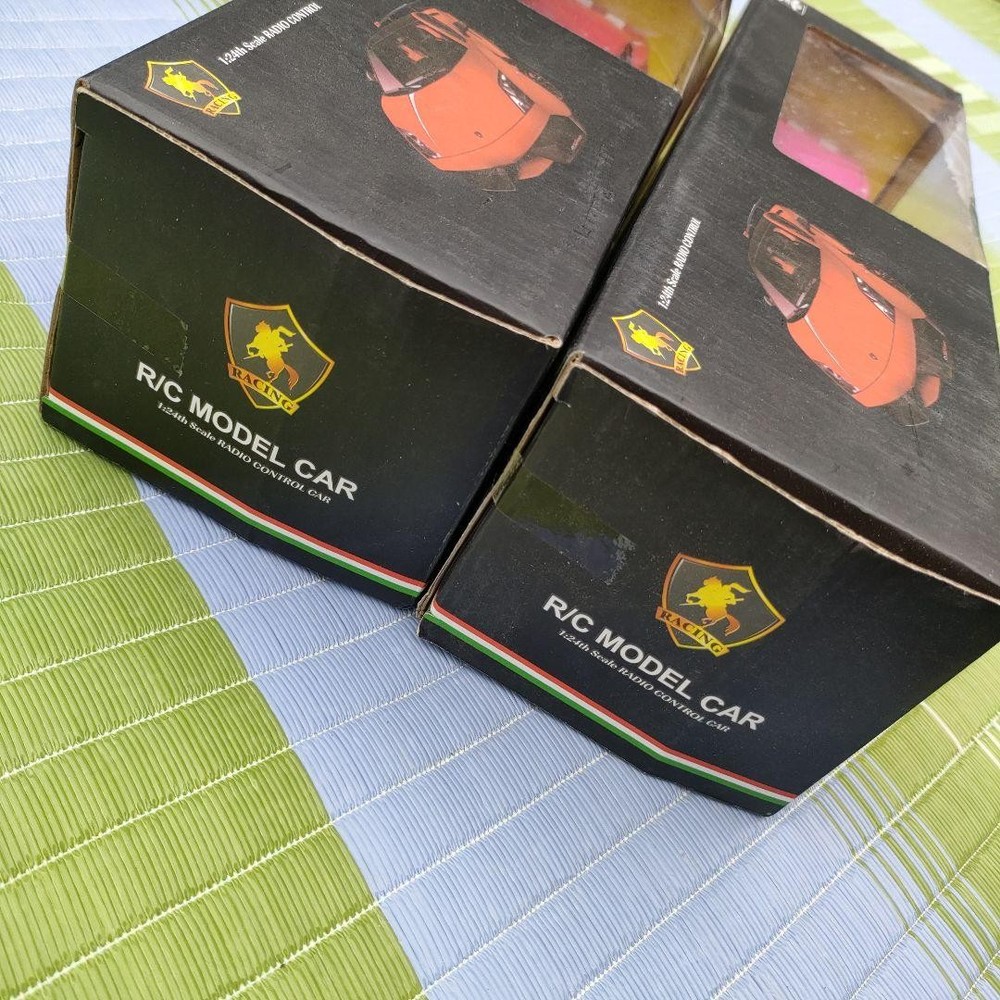 Two plastic radio-controlled cars