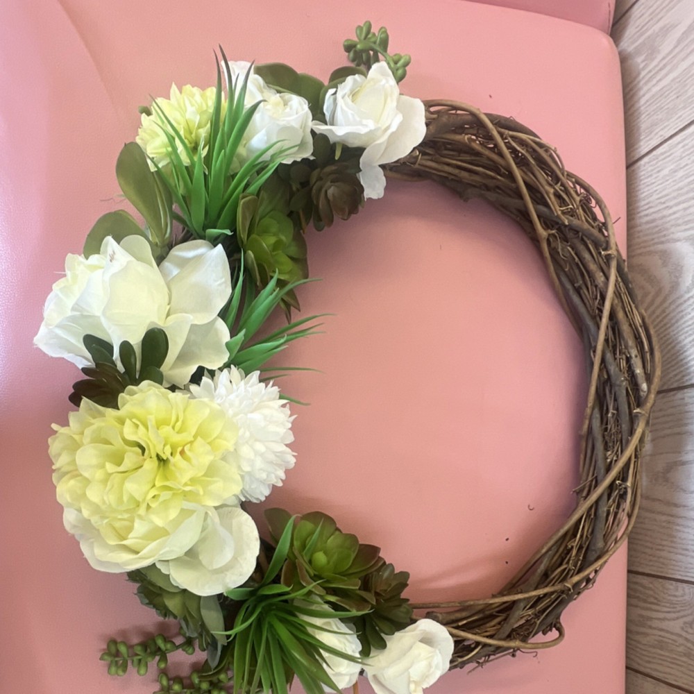 Old grapes vine with artificial white flower