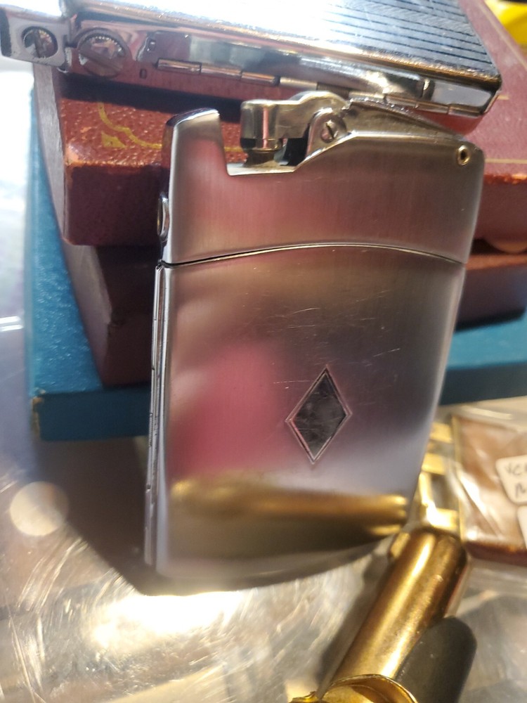 ronson lighter case with original lucky strikes and camel cigarettes super rare