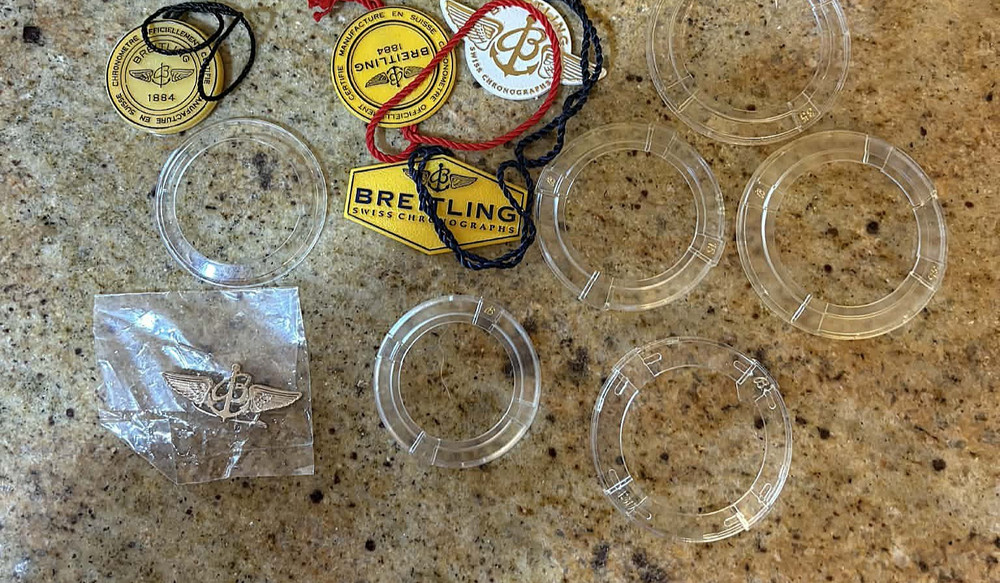 Breitling manuals, (16) Plus tags, Bezel Covers, Etc
