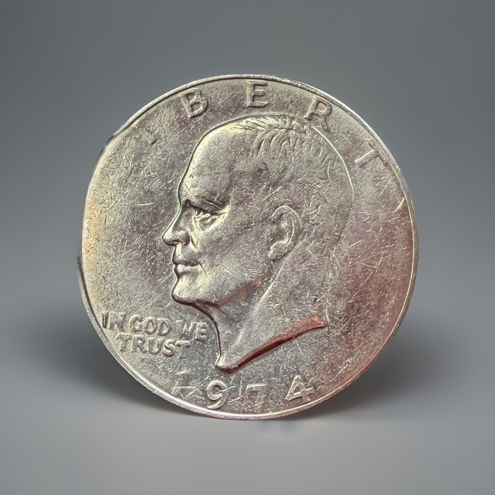1974-P Eisenhower Ike Dollar - Struck Thru Grease Error