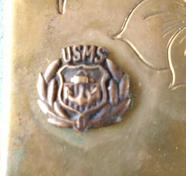 vintage compact with Merchant Marine pin on front