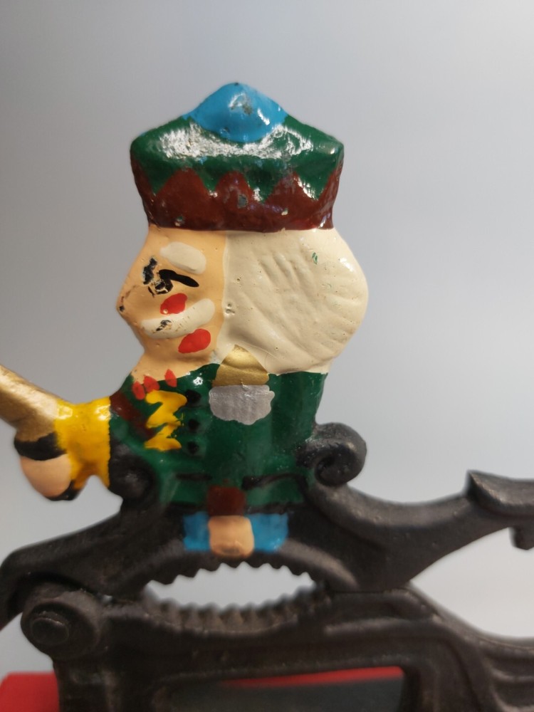 Cast Iron Painted Soldier Nut Cracker on wood base