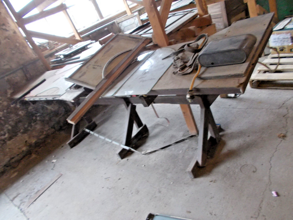 Sturdy wood work bench with power hookups 12 ft long