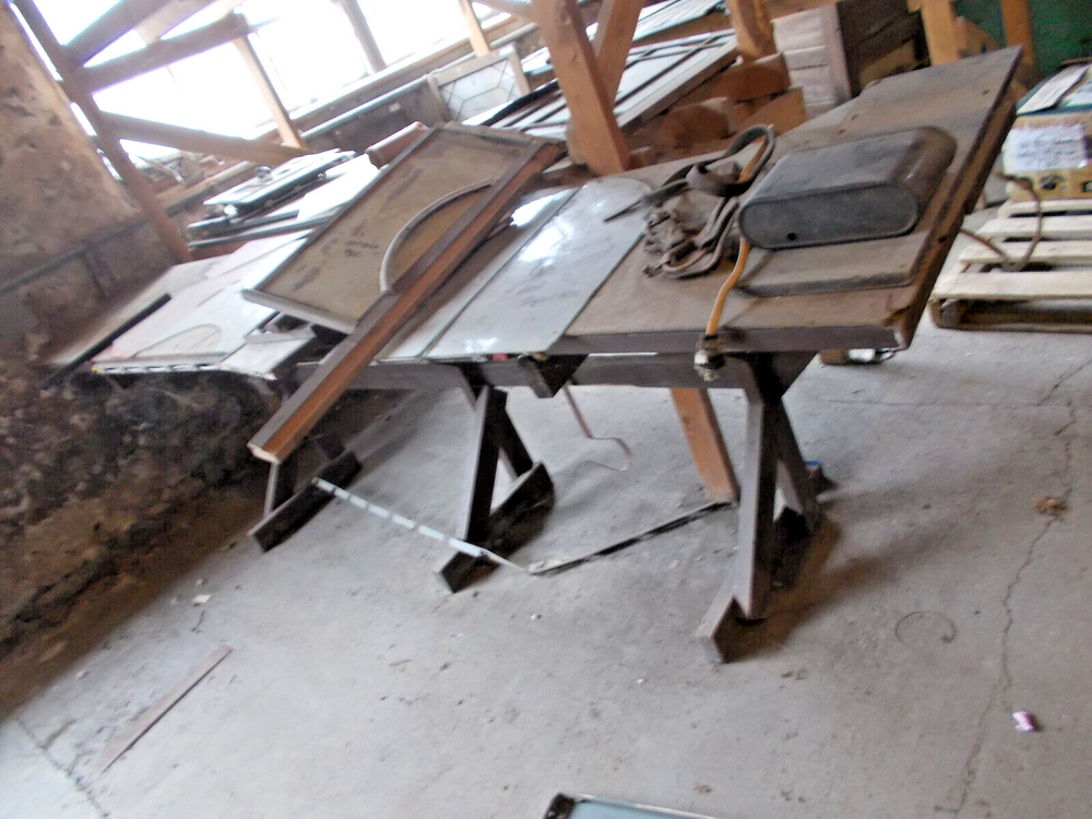 Sturdy wood work bench with power hookups 12 ft long