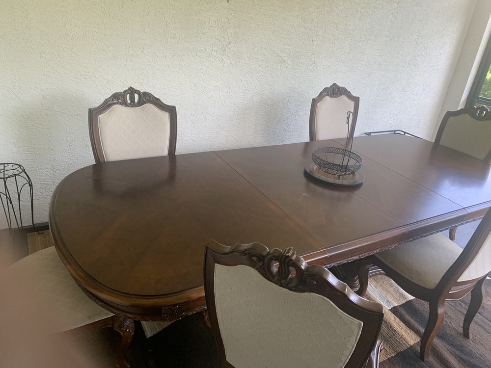 Large solid wood dinning room table chairs Included *PRICES NEGOTIABLE