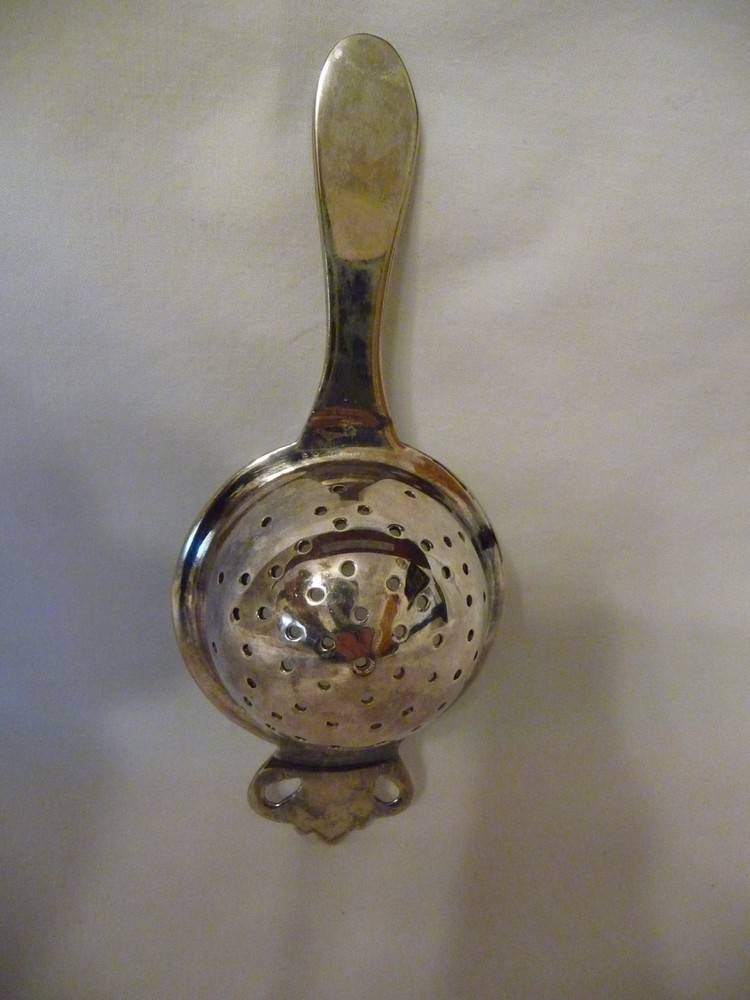 Vintage ornate stainless tea strainer