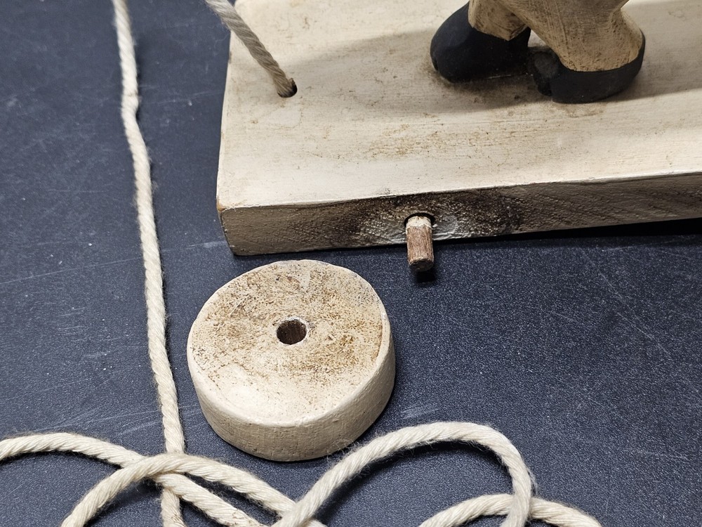 Antique Lion pull toy on wooden platform