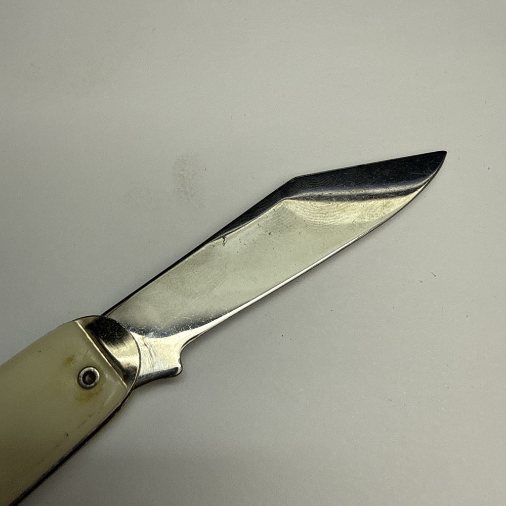 Vintage Seagram's Off-White Plastic Handle Folding Pocket Knife