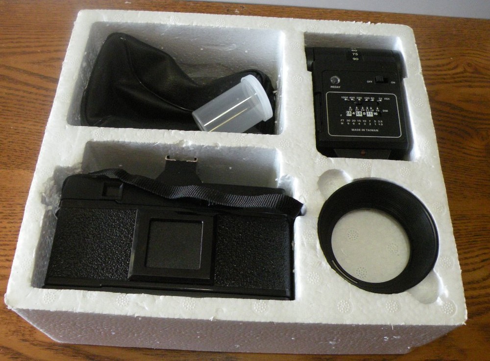 Minotex 2000 35MM camera with flash attachment and case in original box