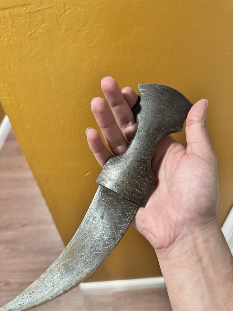 antique dagger with gold and silver engravings