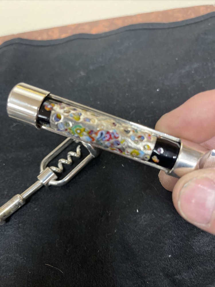 Silver corkscrew and bottle opener with blown glass insert