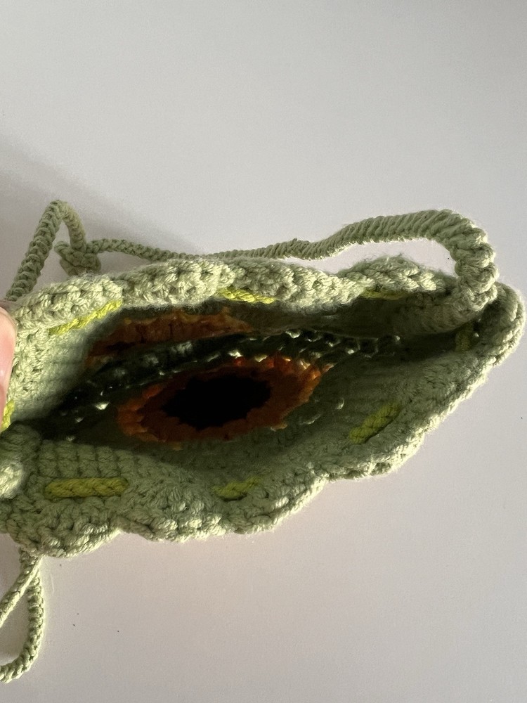 handmade crochet green pouch with sunflower