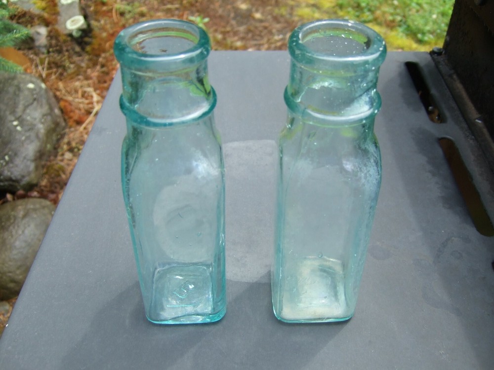 Lot Of 2 Green Bottles