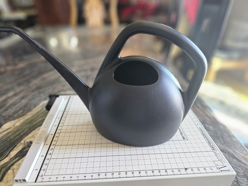 Watering can in blue or black