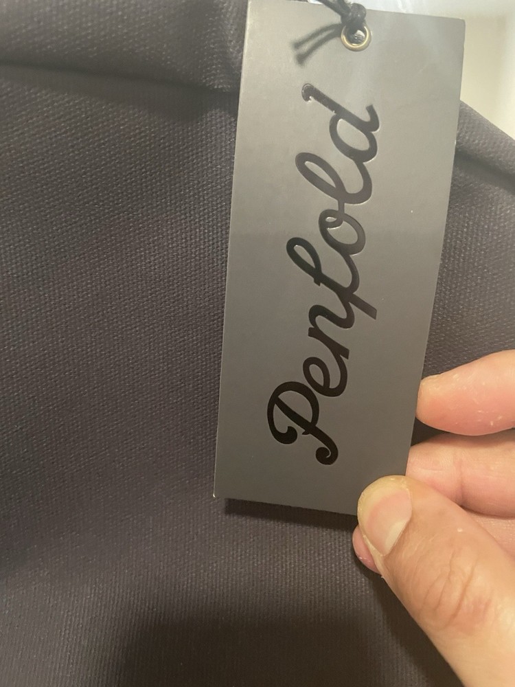 Penfold Heritage Backpack" and "USGA 1894 Shield"