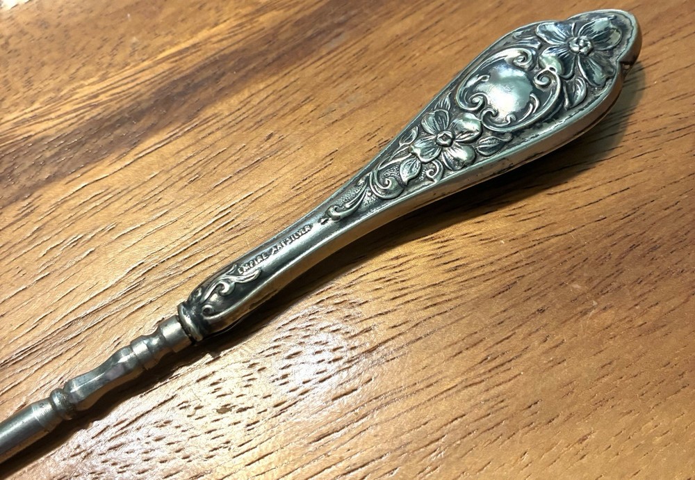 Ornate Empire Art Silver Plate Button Hook with a scrolled Victorian Handle.