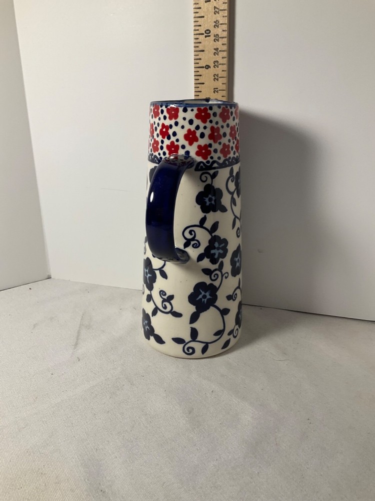 Decorative blue and red flowered pitcher 8”
