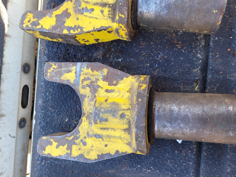 Two Yellow Locking Heavy Equipment Pins Inserts